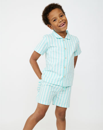 Boy in matching Cabana Stripe shirt and shorts